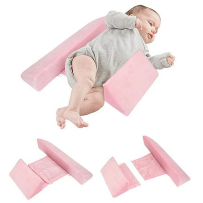 Ergonomic newborn baby sleep pillow with triangular design and removable pillowcase for comfortable, supported side sleeping