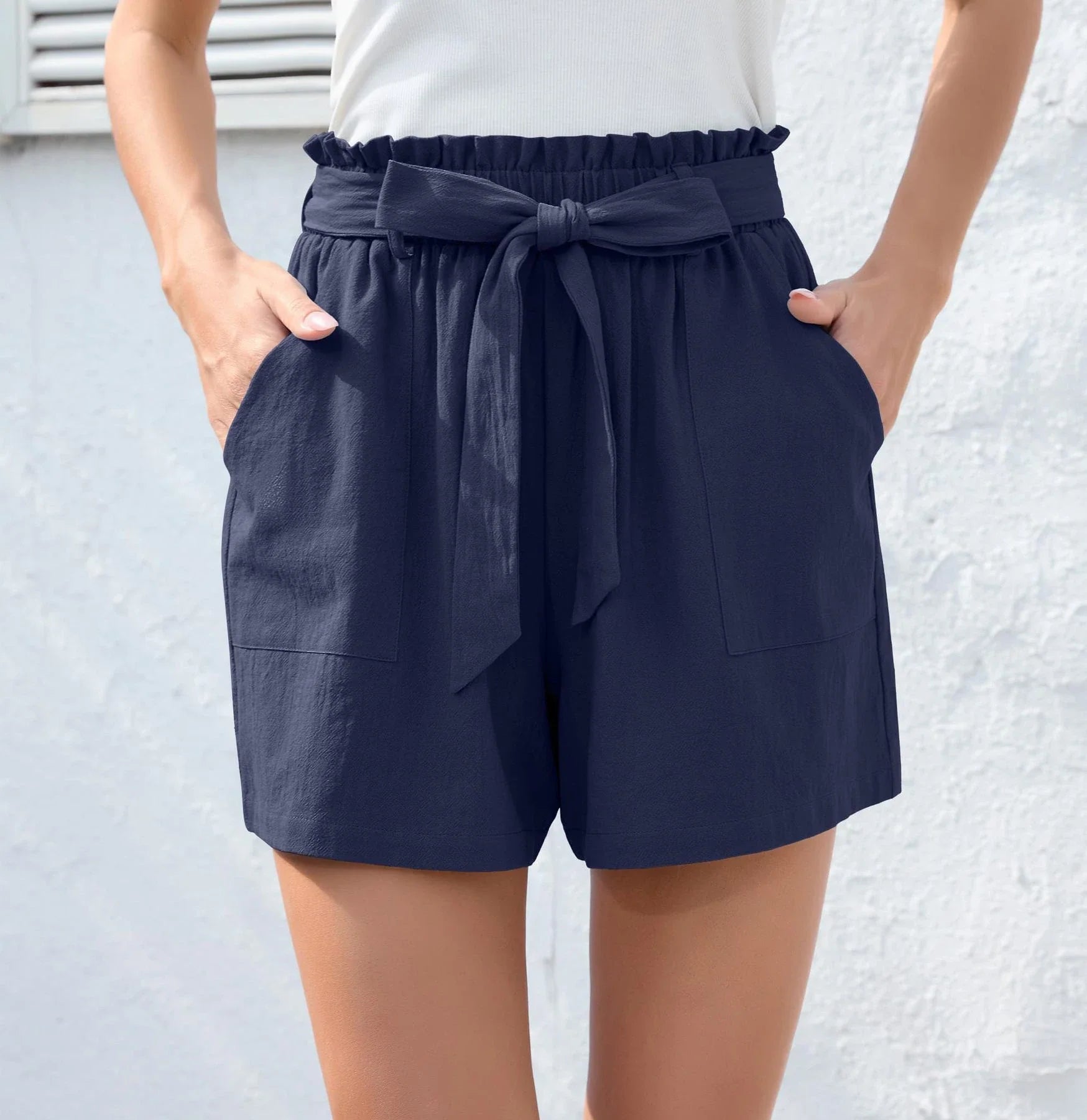 Stylish high-waisted ruffle bow shorts in black, perfect for Kiwi summer beach and casual wear