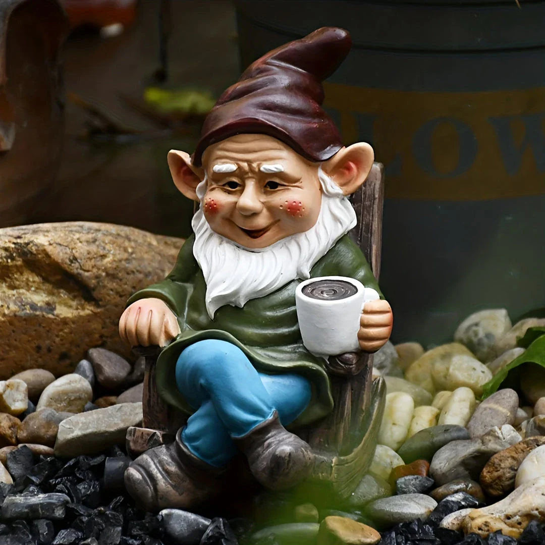 Charming outdoor gnome ornament in a rocking chair, perfect for adding whimsical personality to Kiwi gardens and patios