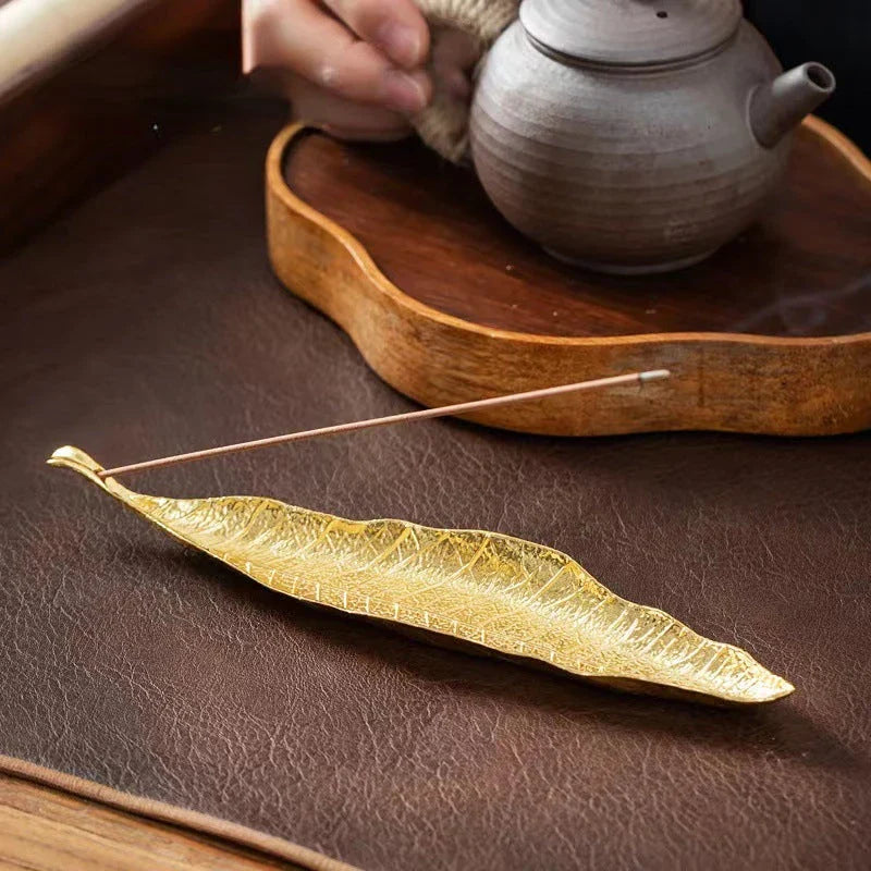 Elegant copper incense stick holder with Bodhi leaf design, perfect for creating a peaceful, serene atmosphere in your New Zealand home