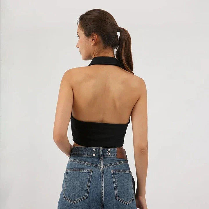 Stylish cotton-polyester cropped halter top in black, featuring a sleek, body-hugging fit and elegant button detail for a chic summer look.