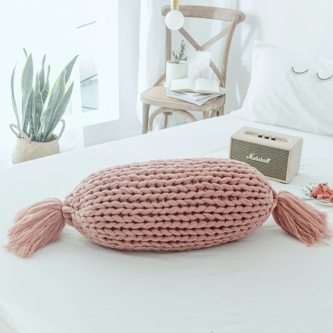 Cosy candy-shaped chunky knit pillow with adorable tassel design, perfect for adding a playful touch to your Kiwi home decor