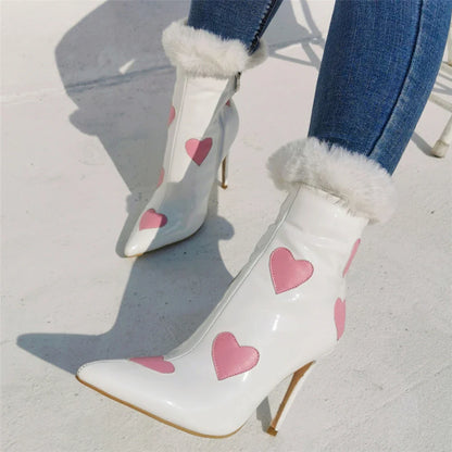 Striking patent leather boots with a peach heart design and pointed toe, perfect for Halloween, parties, or everyday wear.