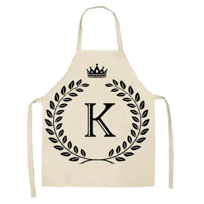 A crown and letter printed kitchen apron made of high-quality cotton and linen, suitable for both men and women in New Zealand kitchens.