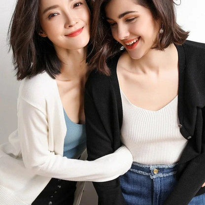 Stylish v-neck cardigan in various colors, featuring a flattering design and luxurious cashmere-rich composition for the modern Kiwi woman