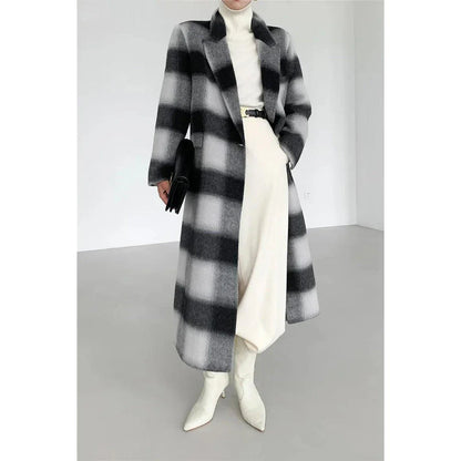 A stylish plaid double-breasted long wool coat for fashionable Kiwi women, featuring a cozy and elegant design with functional pockets and a versatile turn-down collar.