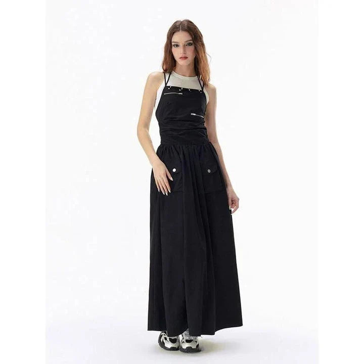 Elegant black backless maxi dress with pockets, perfect for formal events or casual outings.