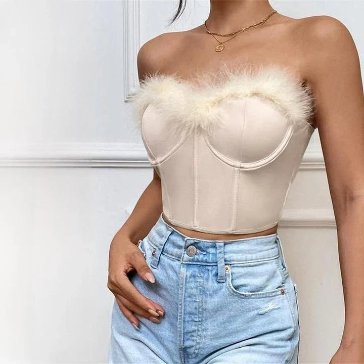 A stylish furry trim corset top in a flattering fit, perfect for adding a touch of glamour to any outfit.