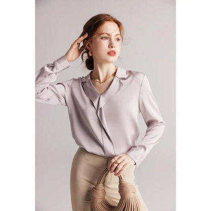 Elegant ruffled silk blouse in champagne color with V-neck design, suitable for professional or casual wear