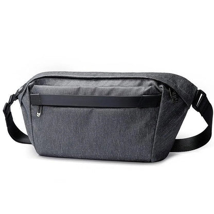 A grey one-shoulder crossbody chest bag with a zippered closure and dedicated pockets for the modern, active Kiwi man
