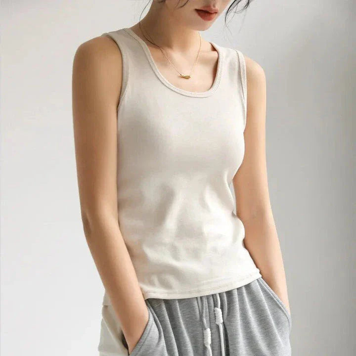 Stylish and versatile solid color tank top with chic strap detail, perfect for Kiwi summer fashion