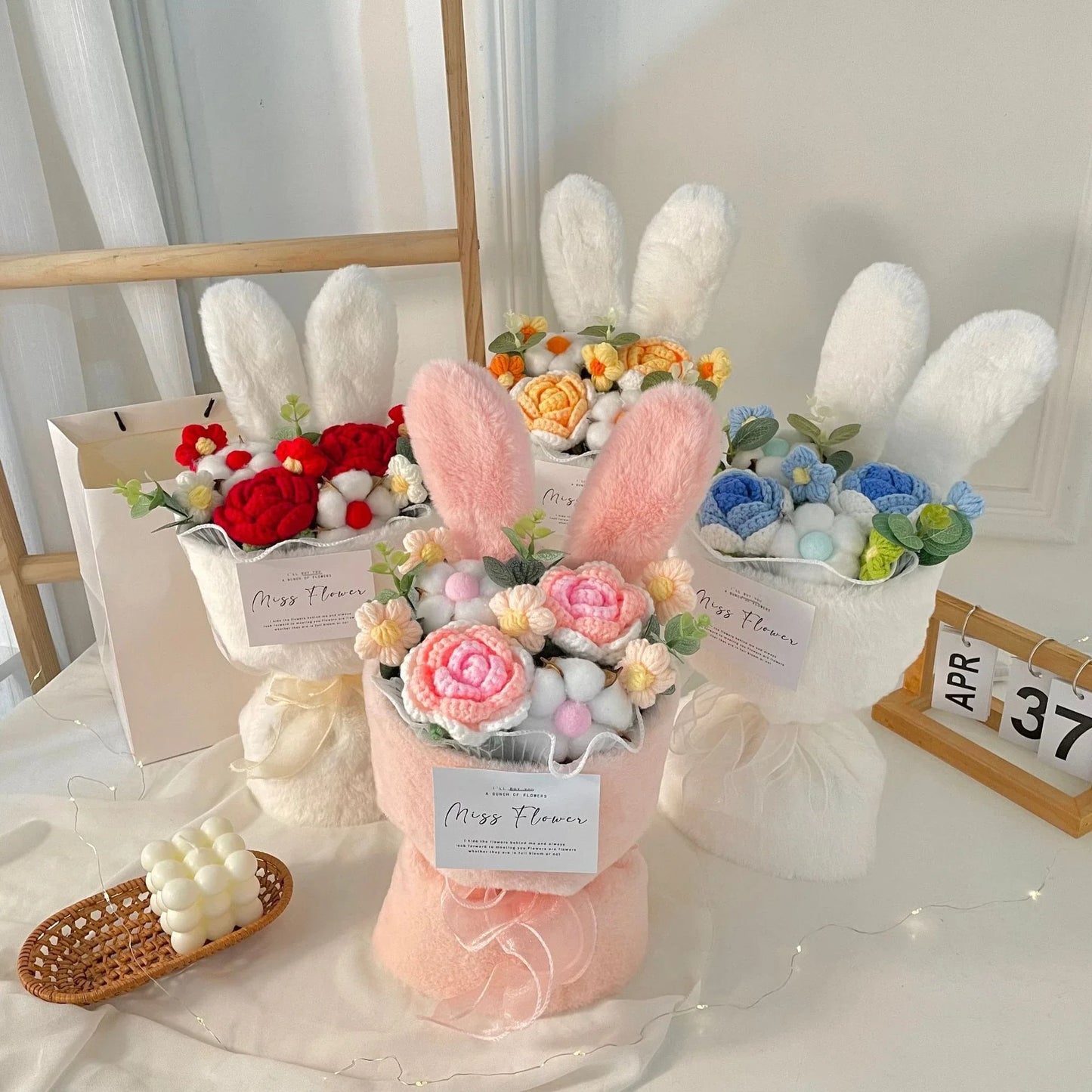 Creative knitted rabbit ear bouquet doll in vibrant colours, a unique and eco-friendly home accessory from New Zealand