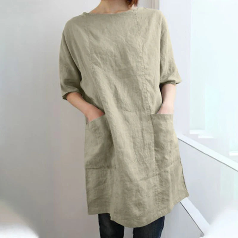 A cotton and linen dress with a round neckline, pockets, and an A-line silhouette in various colors.