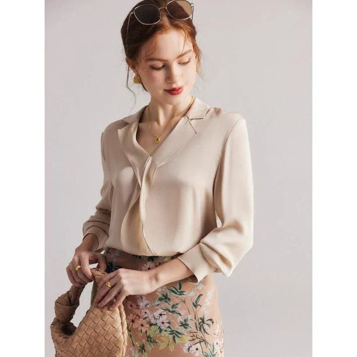 Elegant ruffled silk blouse in champagne color with V-neck design, suitable for professional or casual wear