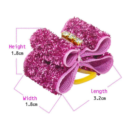 Glamorous glitter hair bows for dogs in a variety of sizes and designs