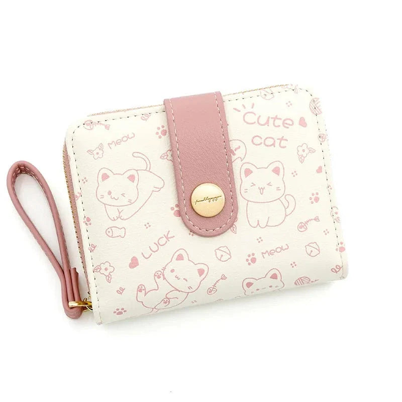 A stylish compact wallet featuring a playful cat-themed design with a tilted head motif, available in a range of candy-inspired colours.