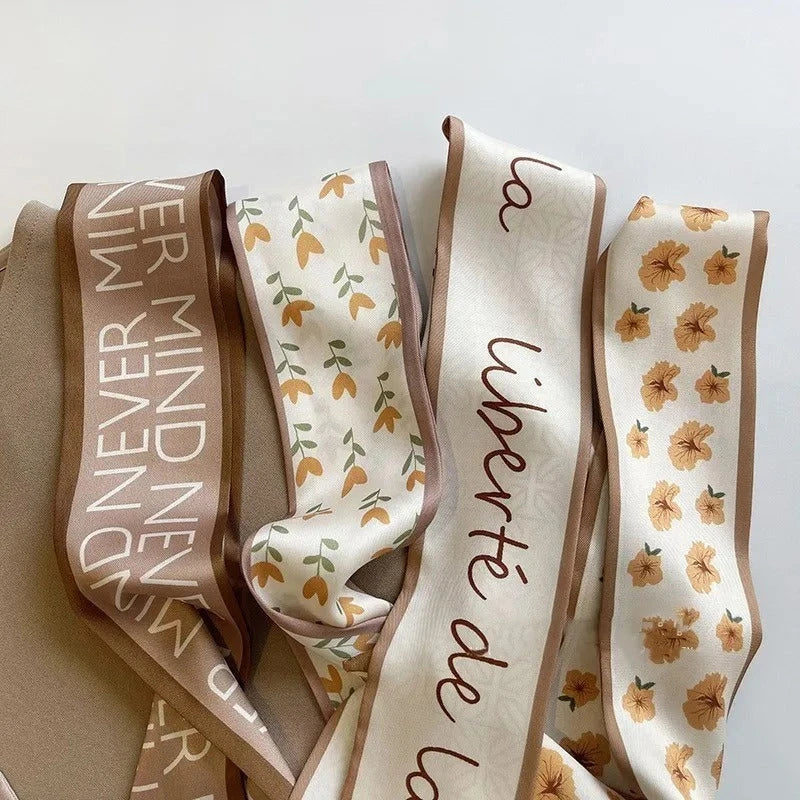 A high-quality silk scarf hair band in a versatile khaki nude color, perfect for adding elegance to any Kiwi outfit.