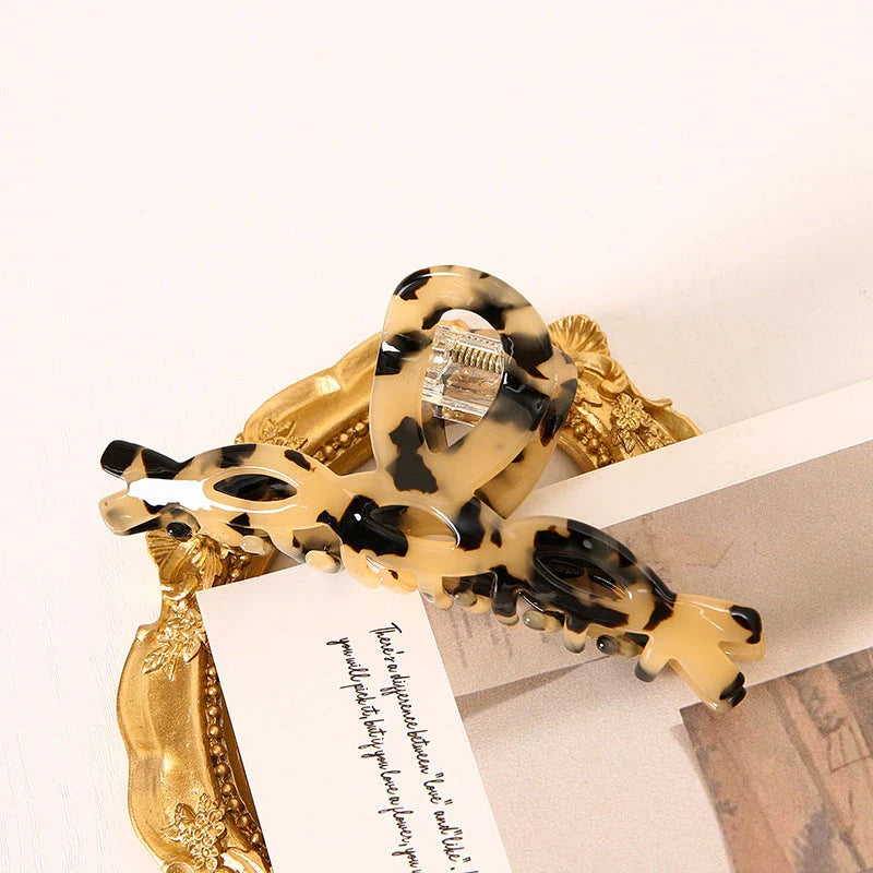 Elegant leopard print hair clip with large weave design, a stylish accessory for Kiwi girls