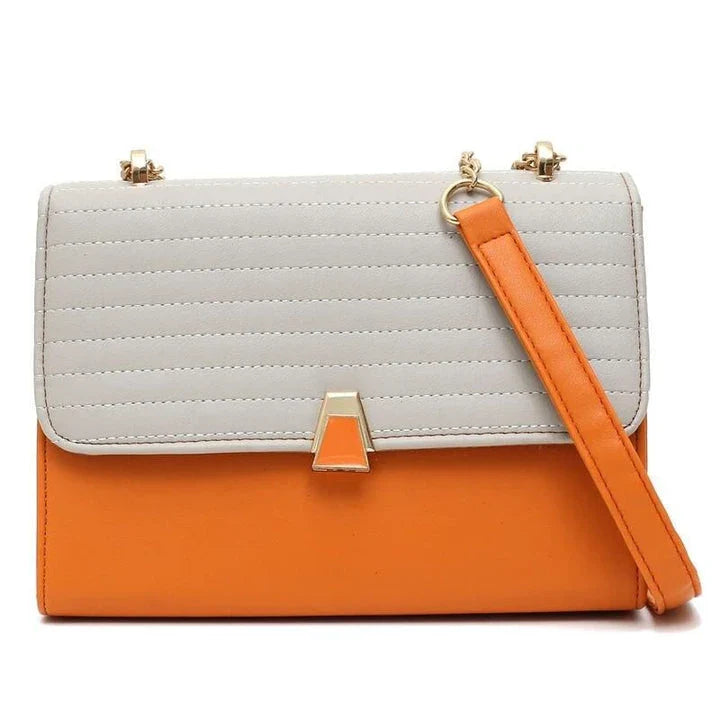 Stylish quilted vegan leather shoulder bag in orange color with unique lock and chain decoration