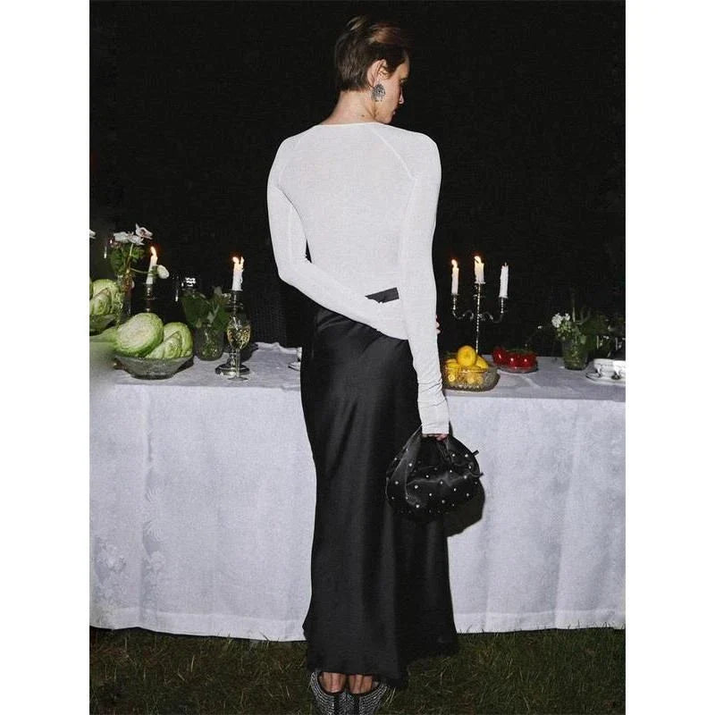 Elegant high-waisted satin maxi skirt in black, a timeless and sophisticated wardrobe essential for the modern Kiwi woman.