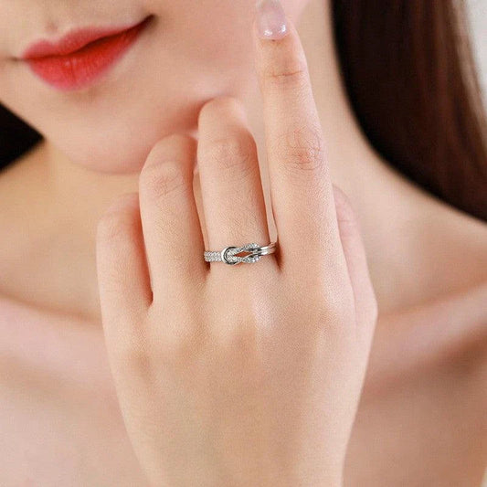 Elegant silver fashion ring with intricate knot design and shimmering zircon accents, a stylish New Zealand icon