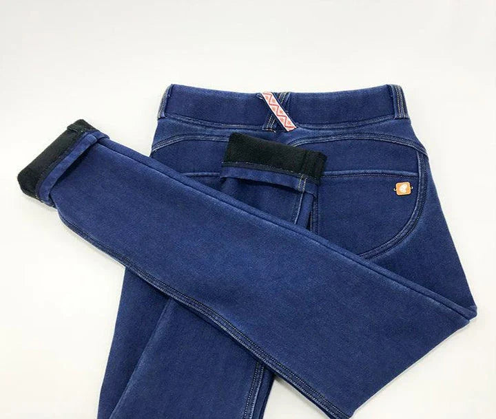 Comfy stretch denim jeans with a yoga pant-inspired design, featuring a tapered leg and subtle distressing for a casual, stylish look.