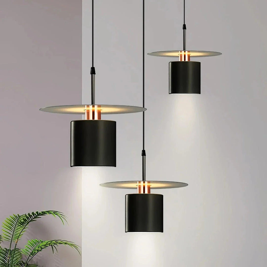A modern, minimalist pendant light with a sleek, painted metal design, perfect for enhancing the ambiance of cafes, bedrooms, and other contemporary interior spaces.