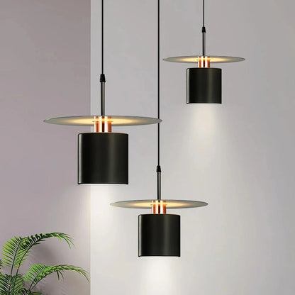 A modern, minimalist pendant light with a sleek, painted metal design, perfect for enhancing the ambiance of cafes, bedrooms, and other contemporary interior spaces.