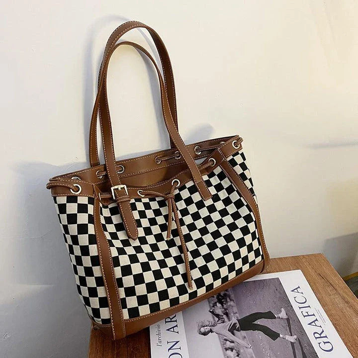 Black PU leather tote bag with a classic checkerboard pattern, perfect for everyday use in the Kiwi lifestyle