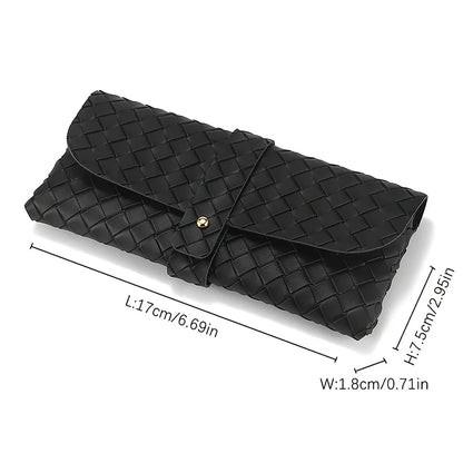 Stylish black and white twist braided leather sunglasses case with snap closure, protecting eyewear in a fashionable way