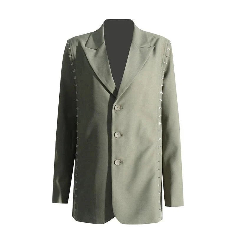 A stylish autumn blazer with a notched metal buckle decoration and camouflage pattern, designed for the modern Kiwi woman