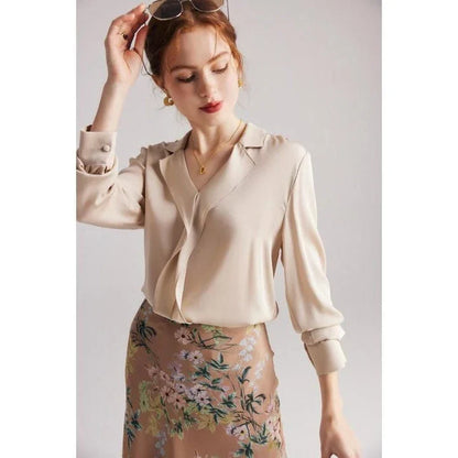 Elegant ruffled silk blouse in champagne color with V-neck design, suitable for professional or casual wear