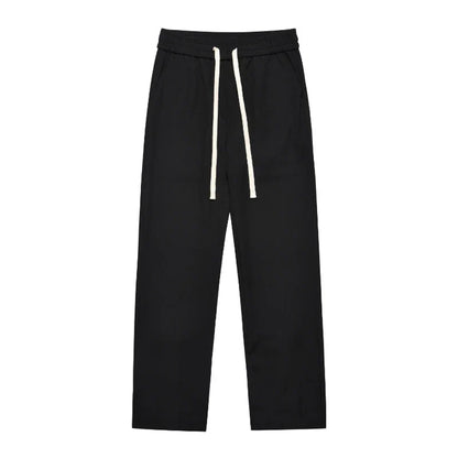 Retro-inspired casual suit pants in black and apricot colors, featuring a mid-waist design and straight leg silhouette for a comfortable, versatile Kiwi look.