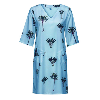Vibrant leaf print casual dress with V-neck and flared silhouette, perfect for the Kiwi lifestyle