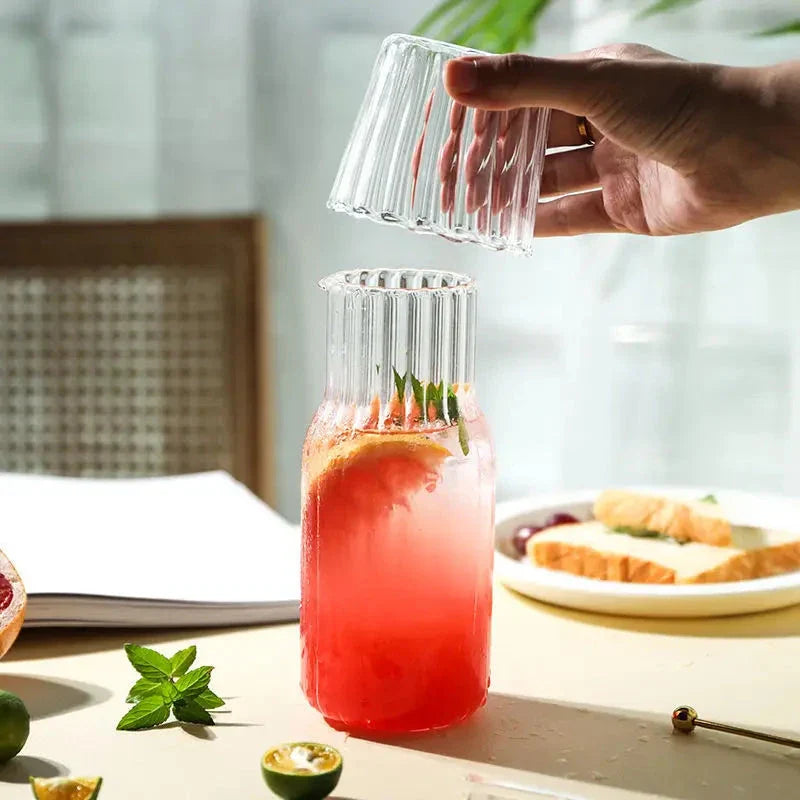 Glass water bottle and teacup set with elegant, transparent design for refreshing hydration