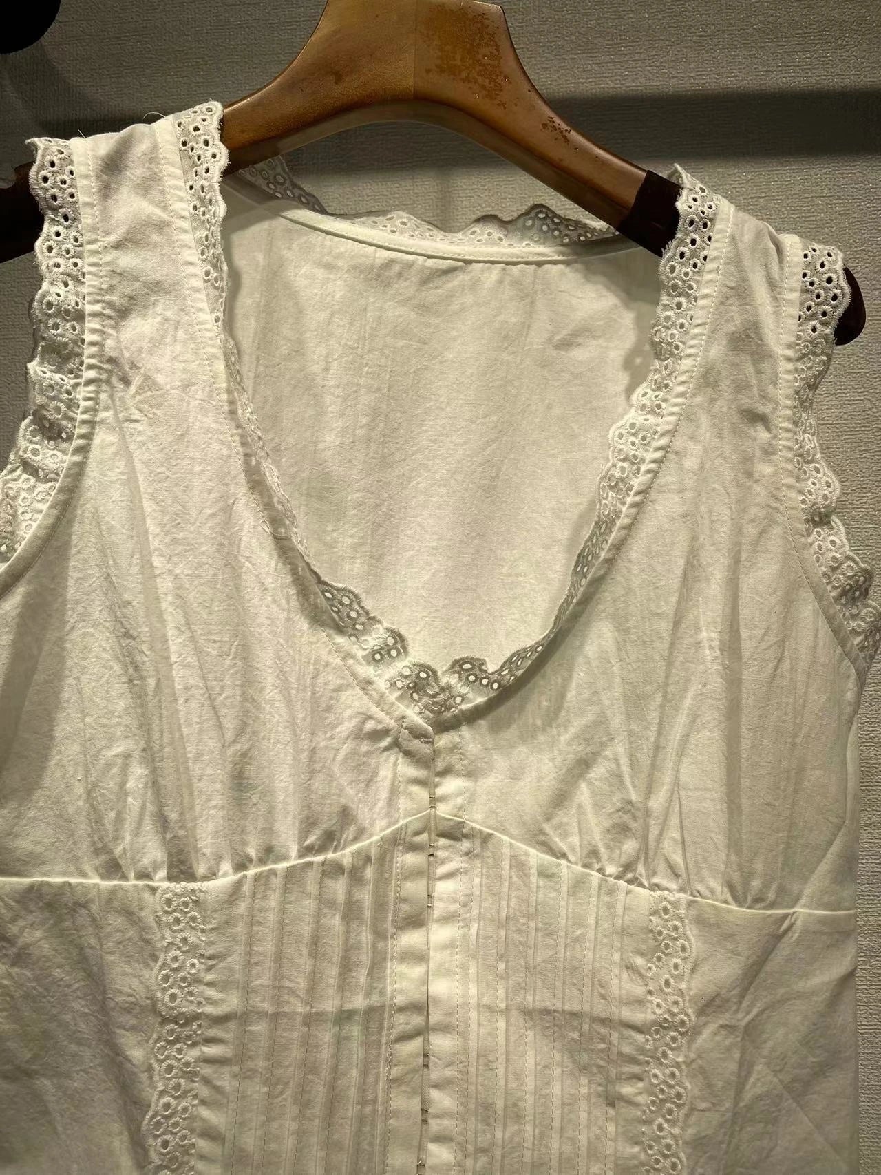 A stylish embroidered lace tank top with a sweet u-collar neckline, made from premium Kiwi-grown cotton.