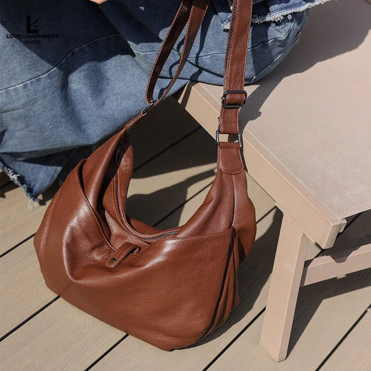 Premium genuine leather crossbody hobo bag with unique stone pattern, ideal for everyday Kiwi style