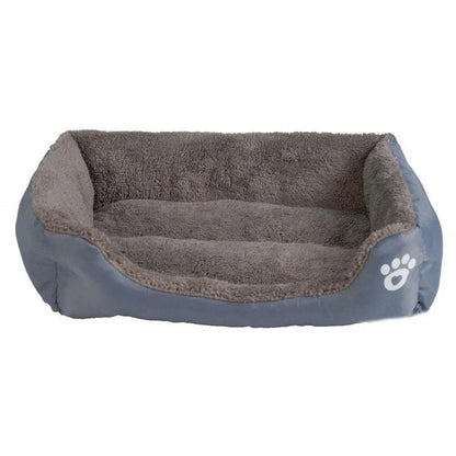 A cozy, waterproof pet bed featuring a soft fleece lining and paw print design, perfect for providing comfort and support for your beloved companion.