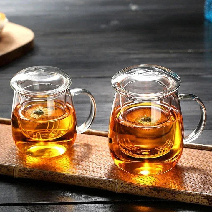 A sleek, minimalist glass tea mug with a touch of Chinese-inspired elegance, perfect for enjoying hot or cold beverages.