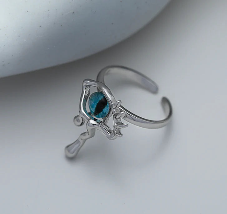 A stylish silver ring featuring a cat-eye design with a devilish twist, perfect for adding a touch of playful elegance to any Kiwi girl's look.