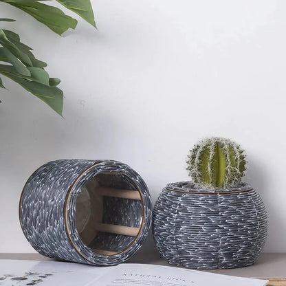 Hand-woven rattan planter with lush greenery, perfect for indoor and outdoor display