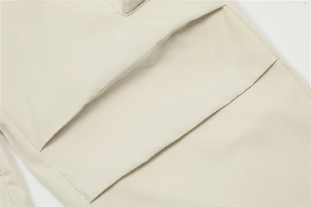 Stylish black overalls with pleated pockets, designed for the active Kiwi lifestyle