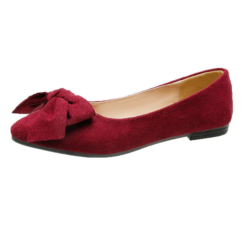 Stylish flat shoes with a pointed toe, low heel, and bow accent, designed for Kiwi women's casual and fashion-forward wardrobes.