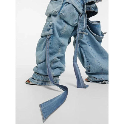 A pair of high-waisted, spliced cargo denim trousers with a distinctive patchwork and hollow-out design