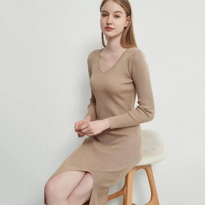 A chic and elegant knitted midi dress in neutral tones, featuring a graceful V-neck, full-length sleeves, and a flattering body-hugging silhouette.