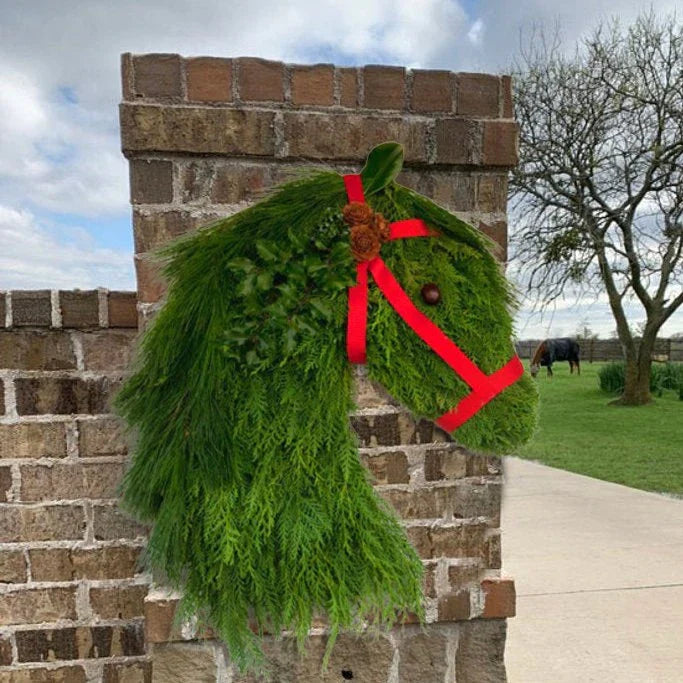 Rustic double horse head Christmas wreath with lifelike pine branches, a unique and charming Kiwi-inspired holiday decoration