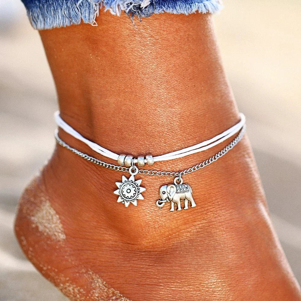 Bohemian-style anklet with star and elephant pendant charms, made from durable zinc alloy in shimmering silver and gold tones