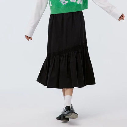 Elegant mid-calf black skirt for women featuring a flattering A-line silhouette and unique irregular hem design