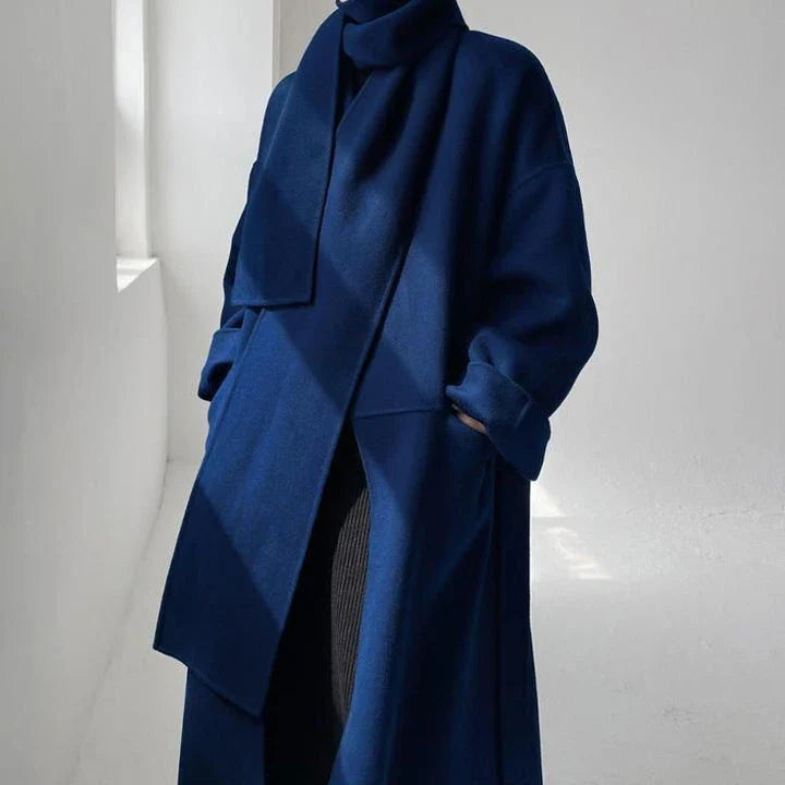 Stylish and warm New Zealand women's woollen coat in blue, featuring a chic scarf collar and relaxed fit design.