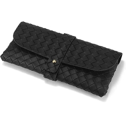 Stylish black and white twist braided leather sunglasses case with snap closure, protecting eyewear in a fashionable way